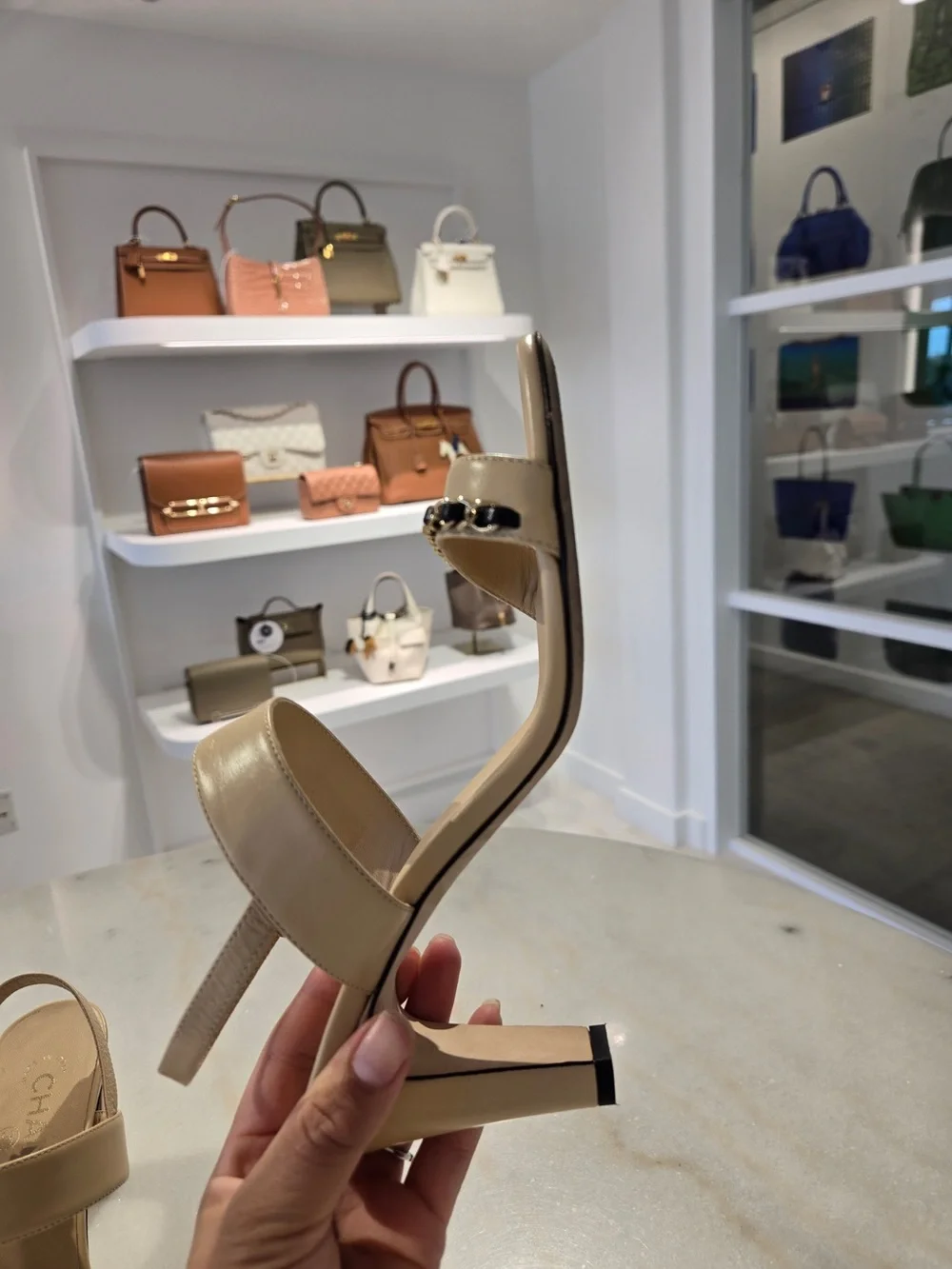 CHANEL Beige Slingback Heels with Black-and-Gold Chain